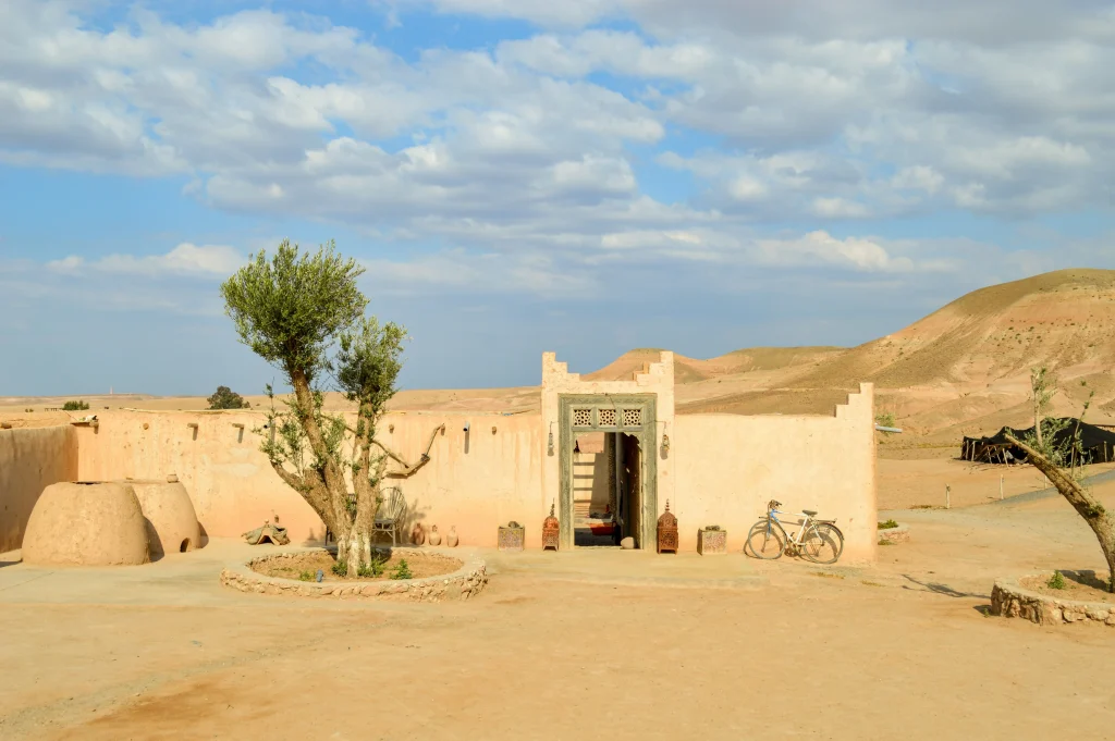 Agafay Desert day trip from Marrakech featuring camel rides and Atlas Mountain backdrop