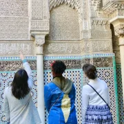 Morocco language guide showing Arabic and Berber script with traditional Moroccan patterns
