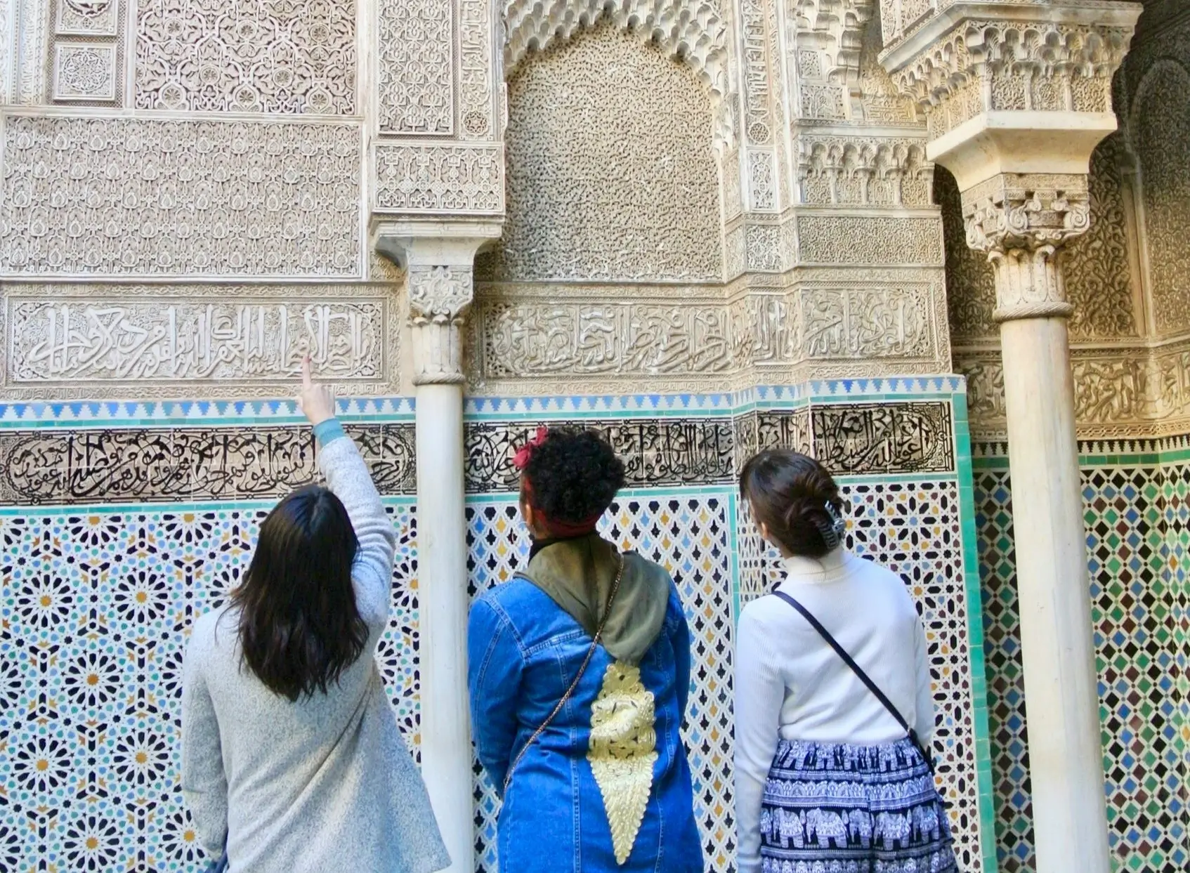Morocco language guide showing Arabic and Berber script with traditional Moroccan patterns